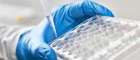 Lab worker using pipette